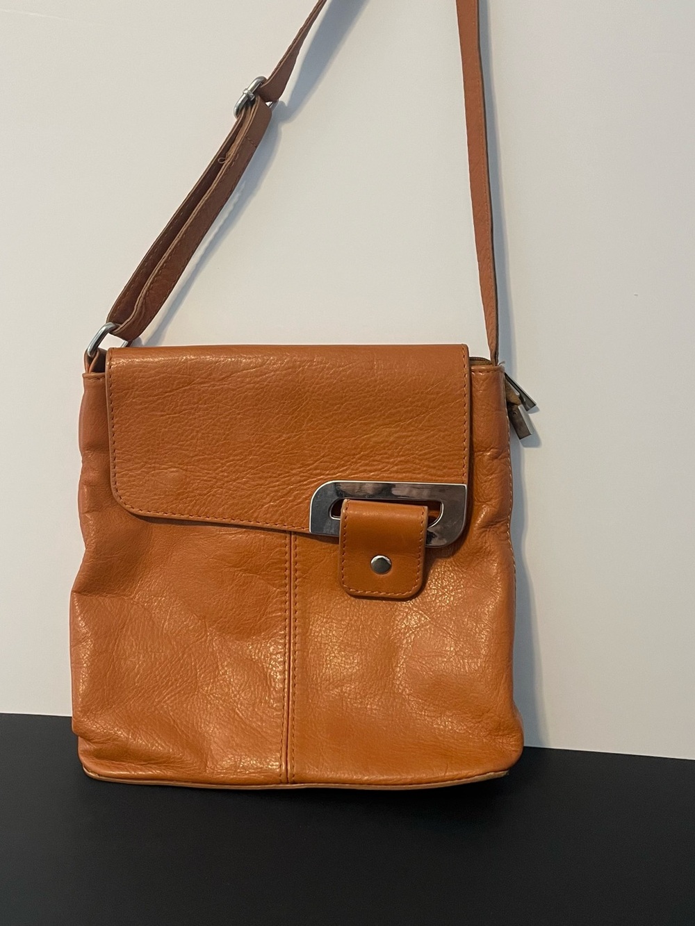 Compact Tan Leather Crossbody with Metal Accent
